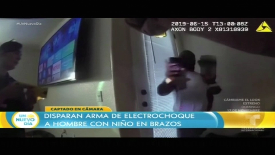 Disparan Arma De Electrochoque A Hombre Con Niño En Brazo