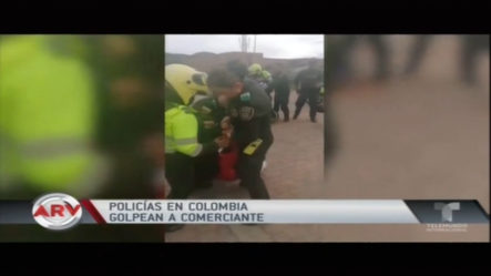 Policias En Colombia Golpean A Comerciante